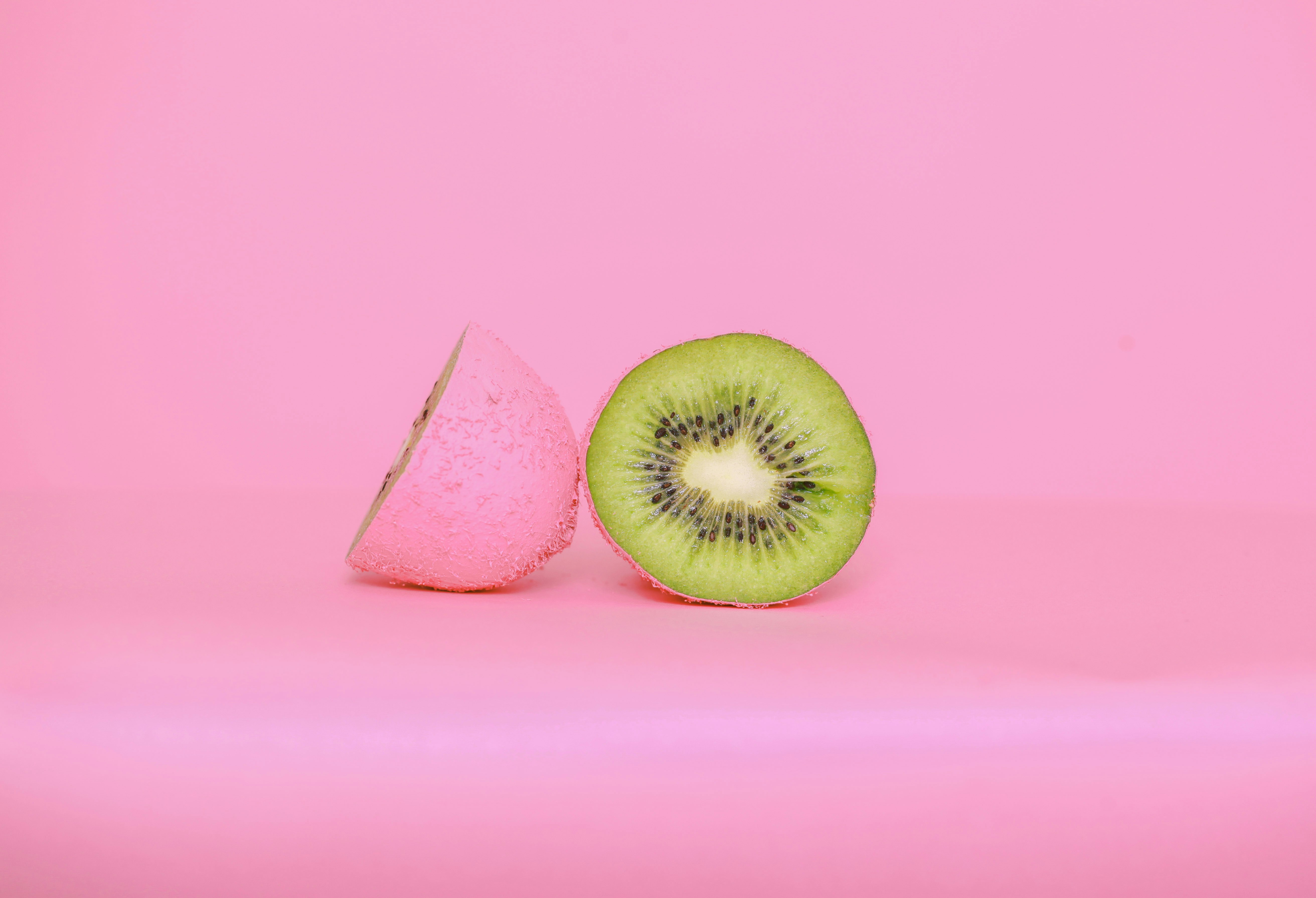 sliced apple fruit beside white paper